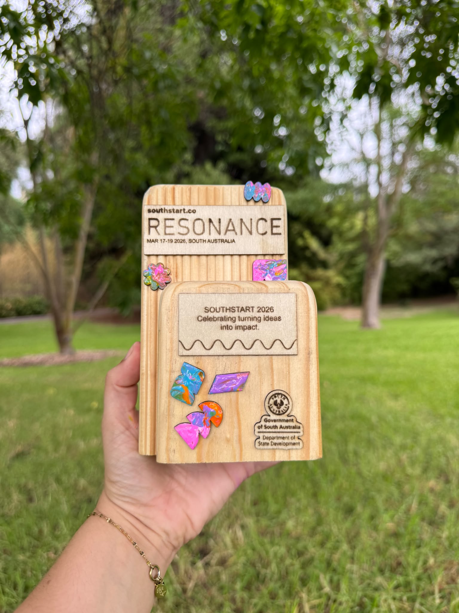 A SouthSTART Resonance 2026 award with hand-painted inlays in reclaimed timber.